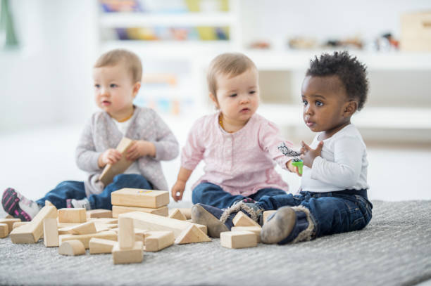 babies playing together